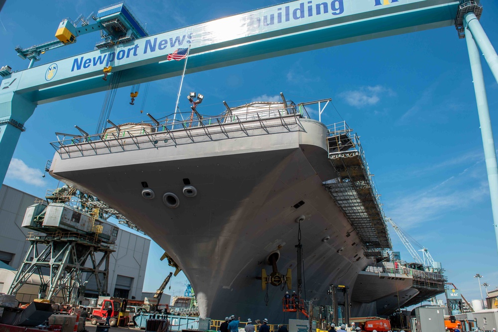 Newport News Shipbuilding contractors prepare to remove the anchor