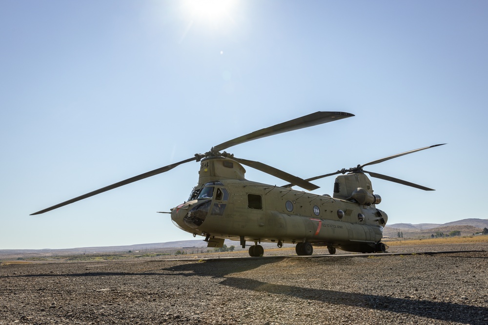 CH-47 Chinook  helicopter stands by to load high school teachers, principals, and school staff