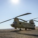 CH-47 Chinook  helicopter stands by to load high school teachers, principals, and school staff