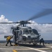 USS Billings Sailors Secure an MH-60S Sea Hawk Helicopter Upon Landing