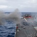 The Arleigh Burke-class guided-missile destroyer USS Rafael Peralta (DDG 115) conducts a live-fire exercise of the 5-inch gun