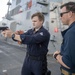 Chief Master at Arms Jonathan Cox (right), from Tyler, Texas, instructs M9 Beretta dry weapon familiarization to Machinist Mate 2nd Class Dayne Hefter (left), from Fond Du Lac, Wis.