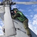 Aviation Electronics Technician 2nd Class Kayla Spencer, from Milton, Fla., conducts maintenance on a MH-60R Seahawk