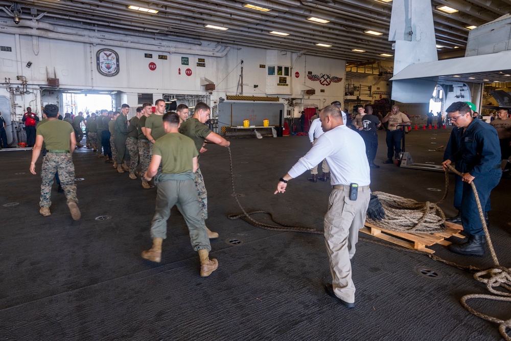 USS America conducts a replenishment-at-sea with the fleet replenishment oiler USNS Tippecanoe