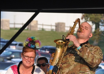 Spc. Jordan Elliff, musician with the 34th Army Band, Sidewinders serenades Lisa Fergus, from Johnston Iowa