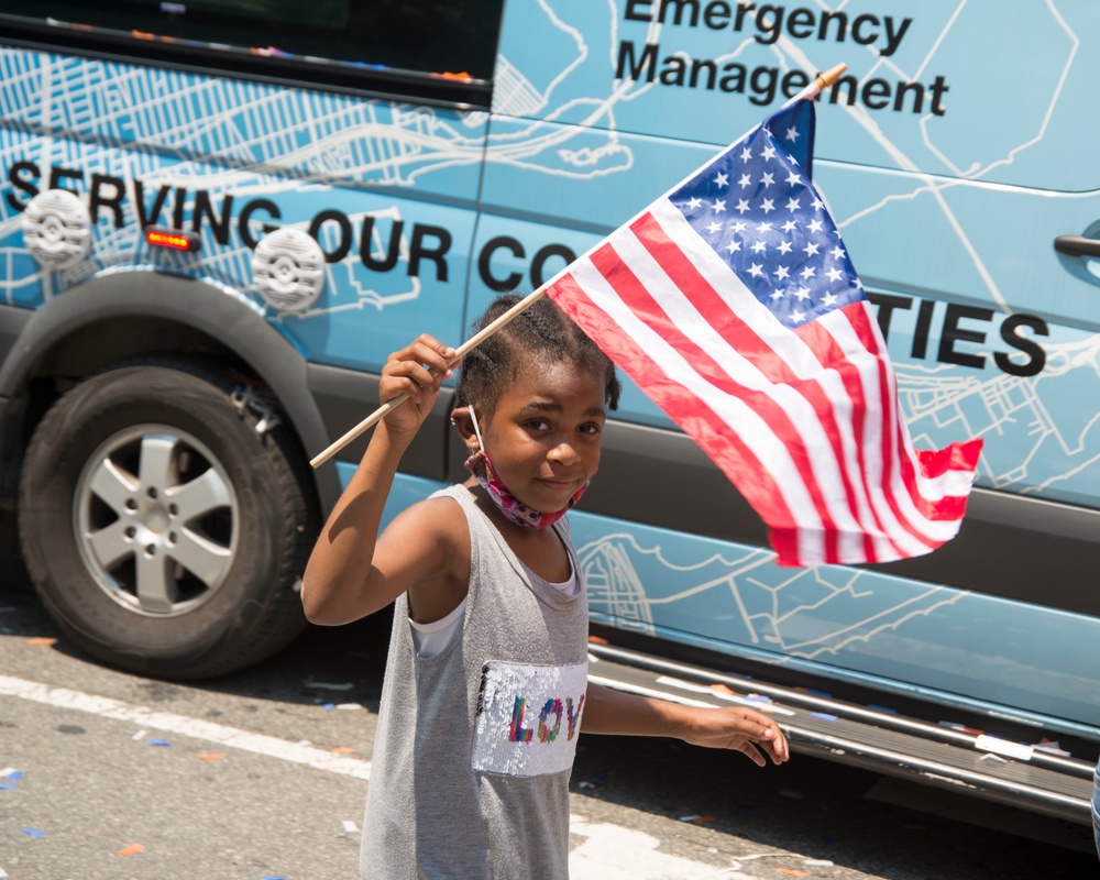 A Child Waving the American Flag