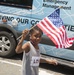 A Child Waving the American Flag