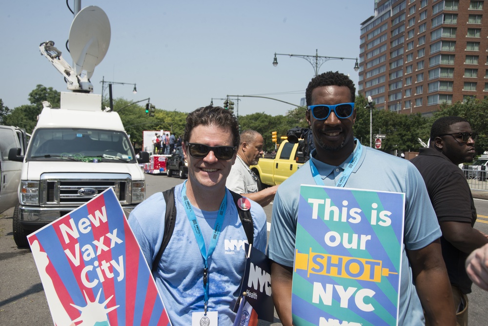 Healthcare Workers with NYC Vaccination Signs