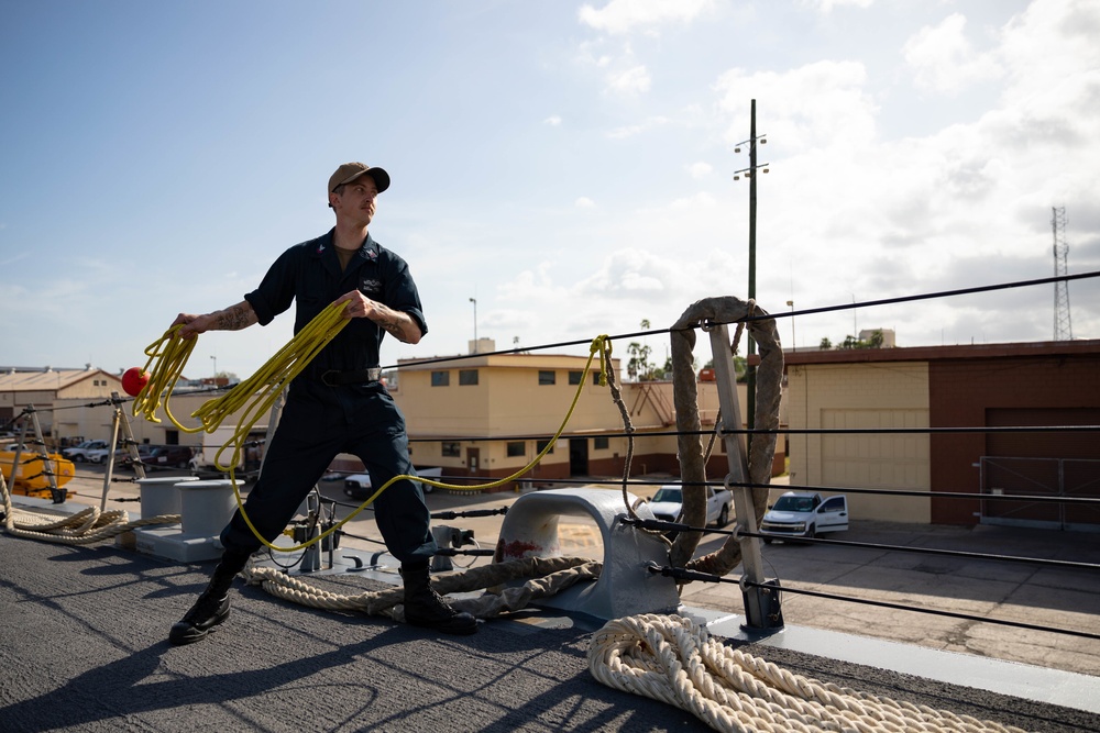 USS Sioux City Sailor Heaves Lines as the Ship Arrives to Naval Station Guantanamo Bay