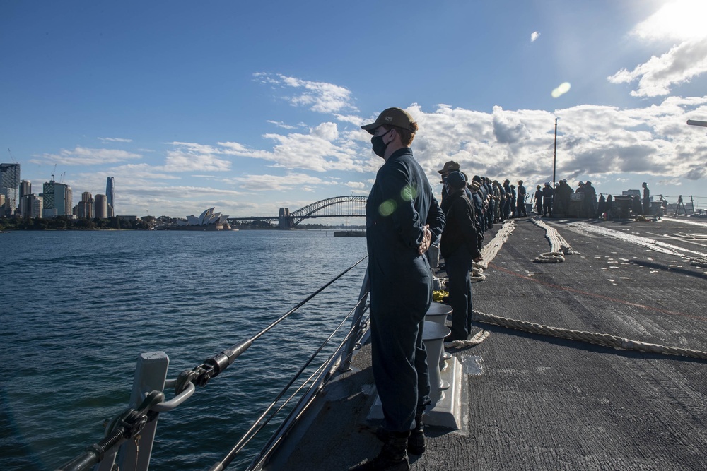 Sailors man the rails aboard USS Rafael Peralta (DDG 115) as they enter Sydney Harbor for Pacific Vanguard 2021
