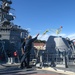 Sailors aboard USS Rafael Peralta (DDG 115) throw a messenger line