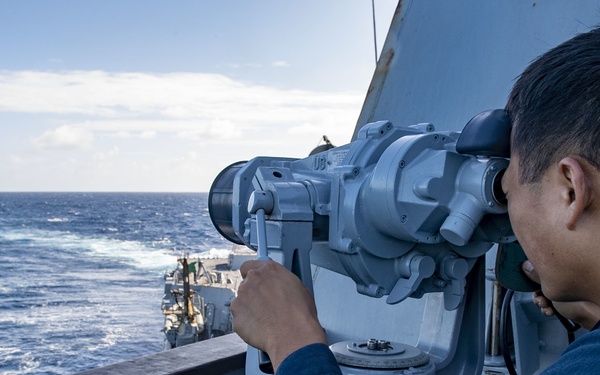 Seaman Yi Zhou, from Los Angeles, Calif,. uses the big eyes