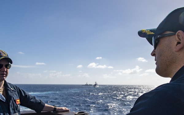 Cmdr. J.J. Murawski (right), commanding officer of the Arleigh Burke-class guided-missile destroyer USS Rafael Peralta (DDG 115), and Cmdr. Charles Cooper (left), executive officer, meet on the bridge wing