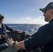 Cmdr. J.J. Murawski (right), commanding officer of the Arleigh Burke-class guided-missile destroyer USS Rafael Peralta (DDG 115), and Cmdr. Charles Cooper (left), executive officer, meet on the bridge wing