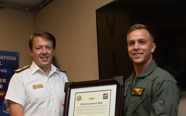 Royal Navy Commodore Phillip D. Nash presents the Britannia Award to 1stLt Benjamin Felhofer