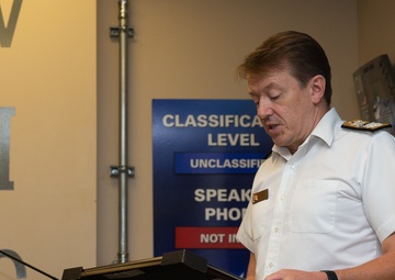 Royal Navy Commodore Phillip D. Nash presents the Britannia Award to 1stLt Benjamin Felhofer