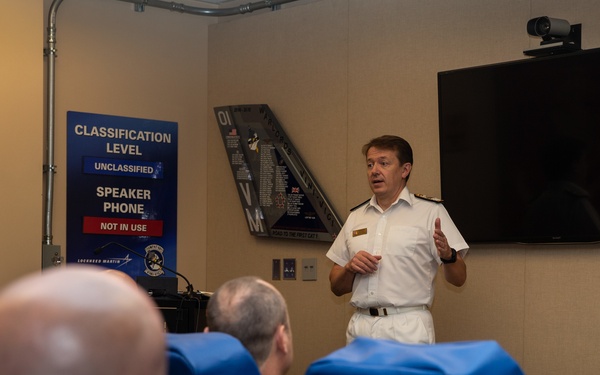 Royal Navy Commodore Phillip D. Nash presents the Britannia Award to 1stLt Benjamin Felhofer