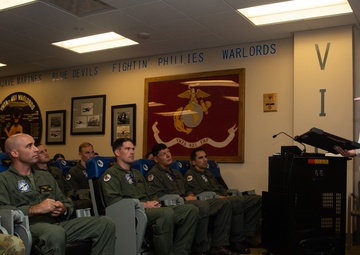 Royal Navy Commodore Phillip D. Nash presents the Britannia Award to 1stLt Benjamin Felhofer
