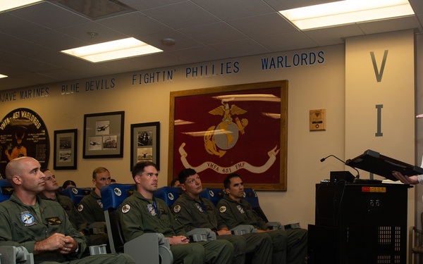 Royal Navy Commodore Phillip D. Nash presents the Britannia Award to 1stLt Benjamin Felhofer