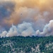 Helicopter drops water on the Beckwourth Complex Fire July 8, 2021 near Frenchman Lake in N. California