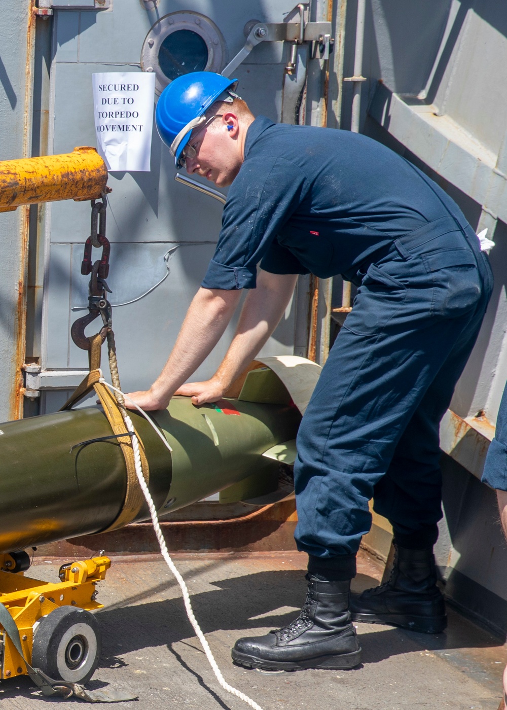 Sailor Transports Torpedo