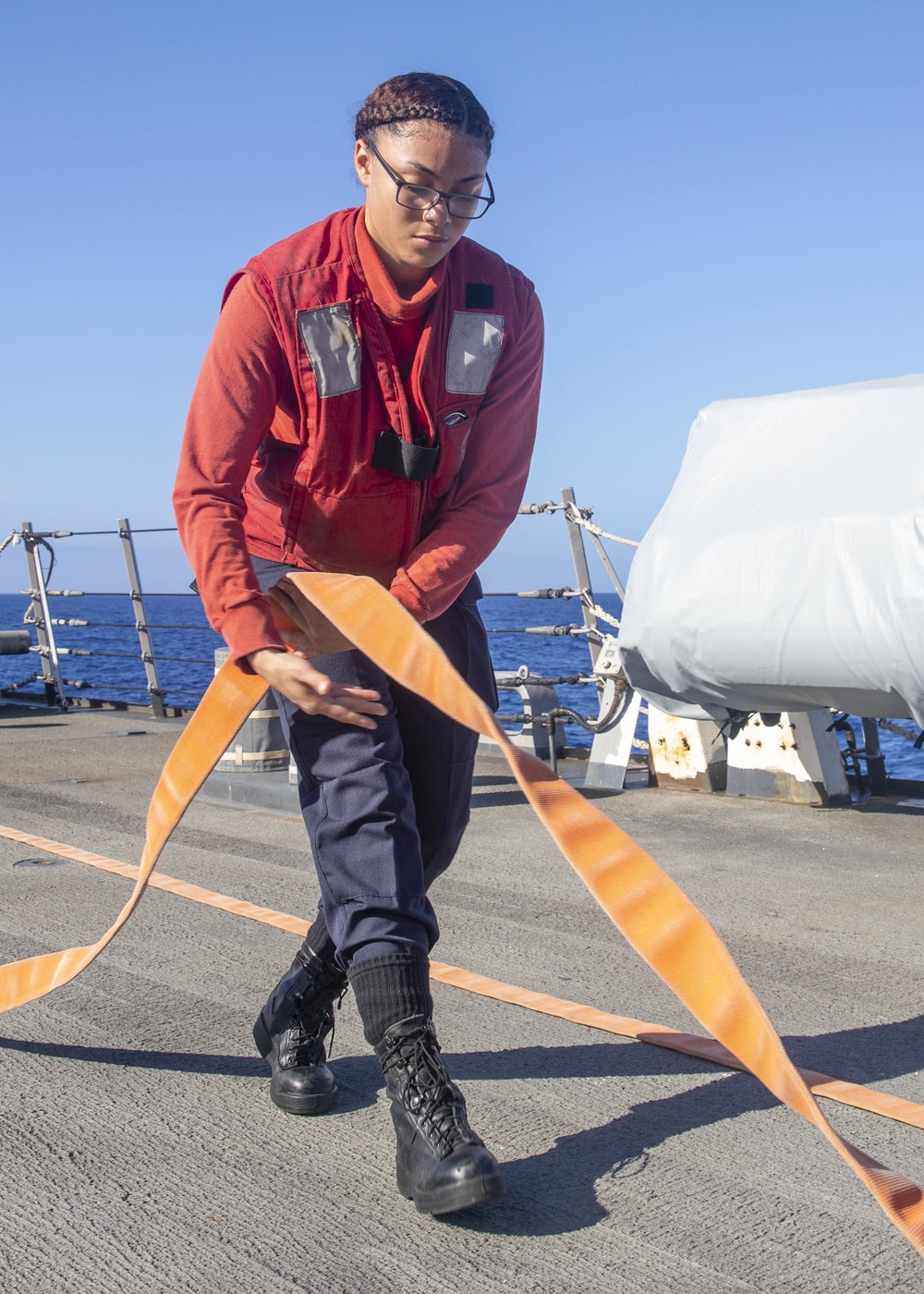 Sailor Lays Out Fire Hose