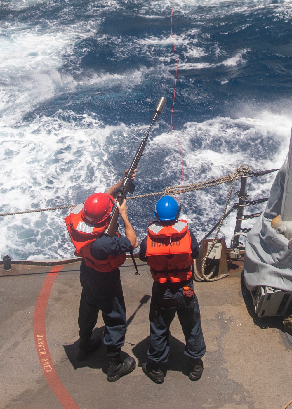 Sailors Fire Line to USNS Alan Shepard