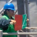 Sailor Signals USNS Alan Shepard During Replenishment At Sea