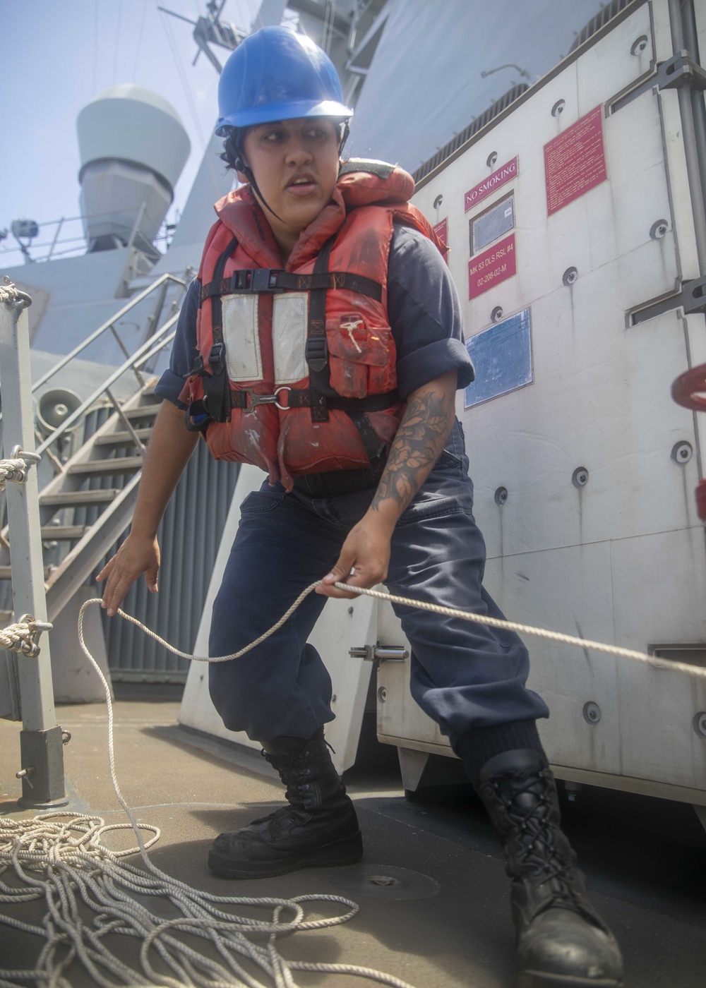 Sailor Heaves Line During Replenishment At Sea