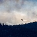 Helicopter drops water on the Beckwourth Complex Fire July 9, 2021 near Frenchman Lake in N. California