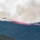 Air National Guard C-130 drops retardant on the Beckwourth Complex Fire July 9, 2021 near Frenchman Lake in N. California