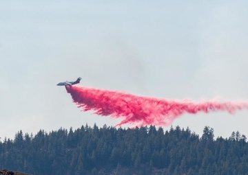 Air Tanker drops retardant on the Beckwourth Complex Fire July 9, 2021 near Frenchman Lake in N. California