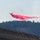 Air Tanker drops retardant on the Beckwourth Complex Fire July 9, 2021 near Frenchman Lake in N. California