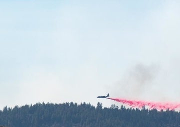 Air National Guard C-130 drops retardant on the Beckwourth Complex Fire July 9, 2021 near Frenchman Lake in N. California