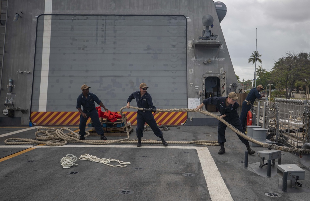 USS Billings Sailors Heave Around a Line on the Flight Deck During Sea and Anchor Detail