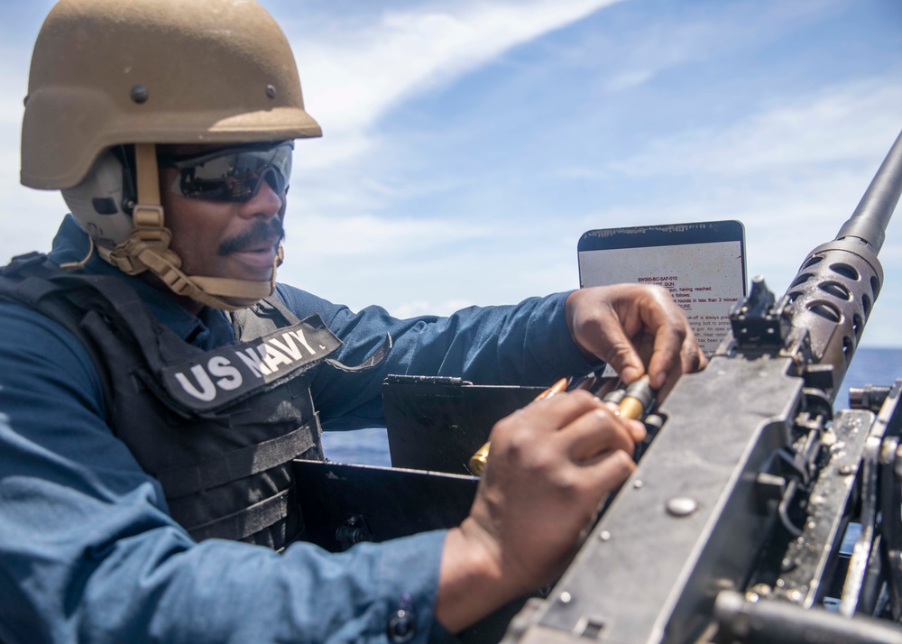 Sailor Reloads Machine Gun During Familiarization Course