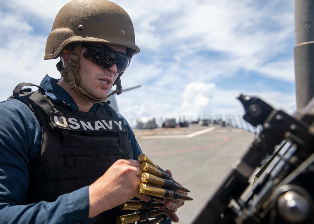 Sailor Reloads Machine Gun During Familiarization Course