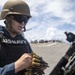 Sailor Reloads Machine Gun During Familiarization Course