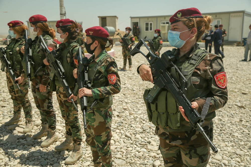 Peshmerga female soldiers run through squad movement drills