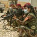 Peshmerga female soldiers run through squad movement drills