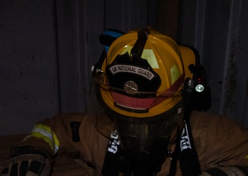 GOING IN BLIND AND LOW: 152nd CES Firefighters show off their confidence in SCBA confined space confidence course