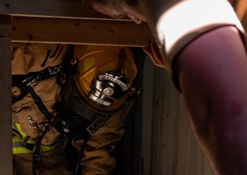 GOING IN BLIND AND LOW: 152nd CES Firefighters show off their confidence in SCBA confined space confidence course