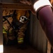 GOING IN BLIND AND LOW: 152nd CES Firefighters show off their confidence in SCBA confined space confidence course
