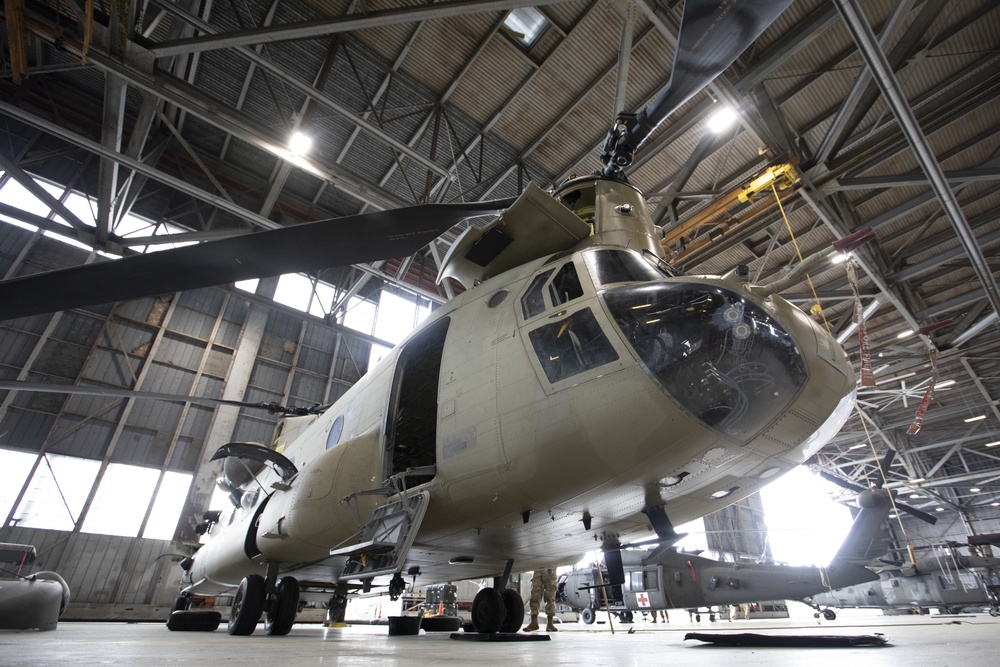 Marne Air Soldiers conduct phase maintenance on a CH-47 Chinook helicopter.