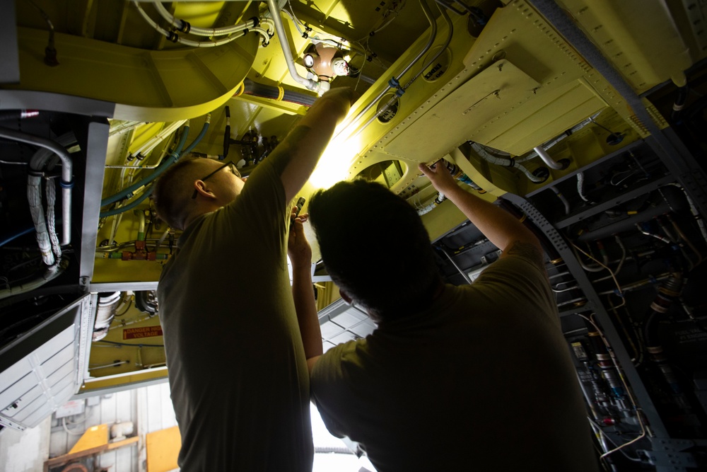 Marne Air Soldiers conduct phase maintenance on a CH-47 Chinook helicopter.