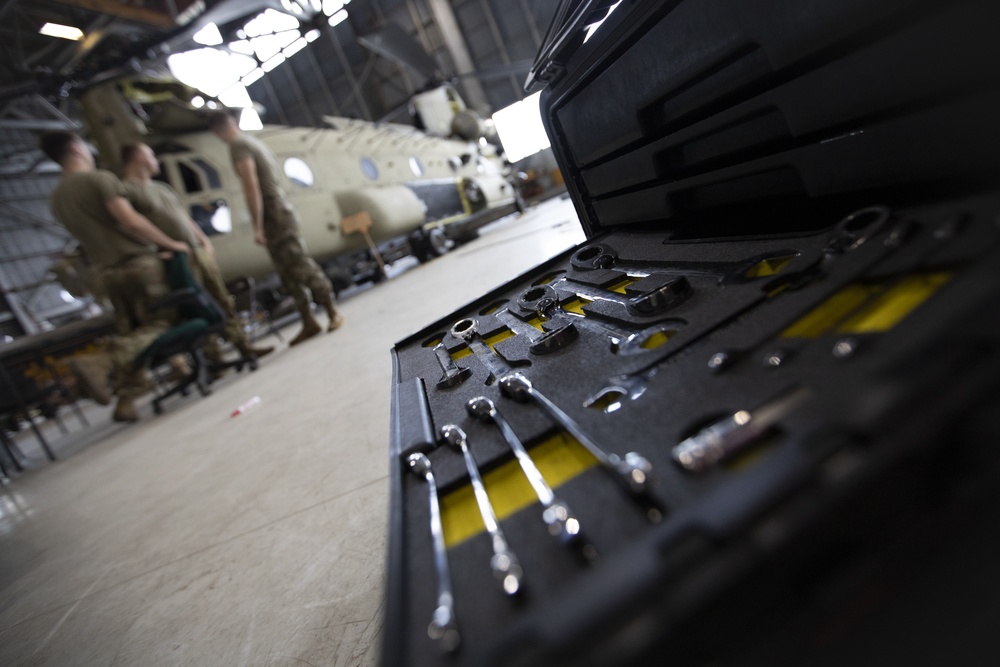 Marne Air Soldiers conduct phase maintenance on a CH-47 Chinook helicopter.