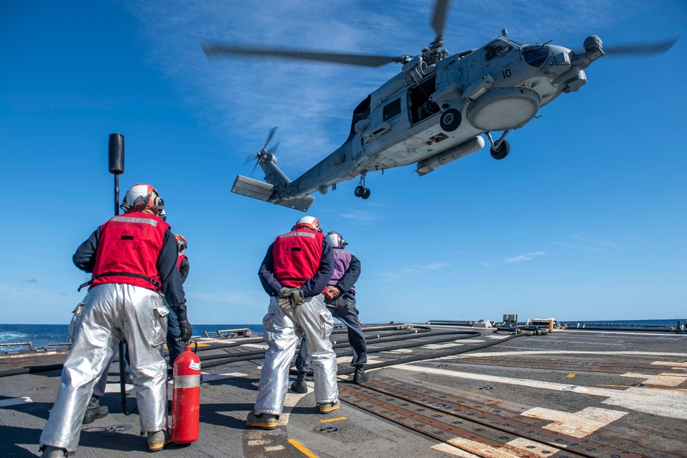 Sailors prepare to conduct a helo in-flight refueling (HIFI) with an MH-60R Seahawk