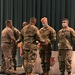 Brig. Gen. Budraitis presents coins to SLC Distinguished Honor Grad and Commandant's List