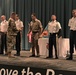 Brig. Gen. Budraitis presents coins to SLC Distinguished Honor Grad and Commandant's List