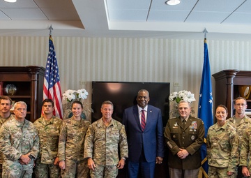 Secretary Austin, Milley greet Miller upon return